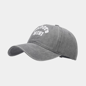 Close-up of DADDY'S MINI print on washed grey cotton baseball cap with curved brim