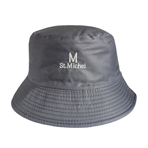 Detailed view of grey reversible bucket hat featuring white St. Michel embroidery