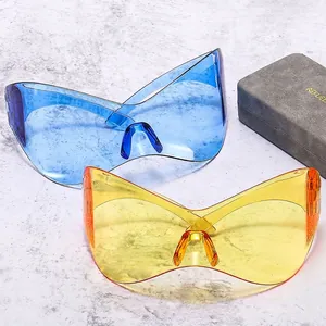 Y2K futuristic wrap-around butterfly sunglasses in transparent blue and orange colors