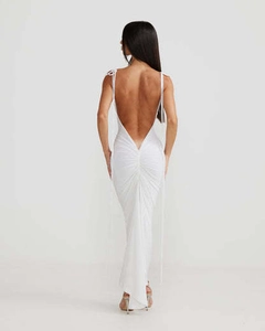 Detailed back view of white ruched backless maxi dress with thin straps and sleek fabric