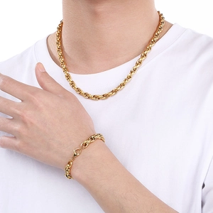 Close-up of a man wearing a 18k gold plated stainless steel curb chain necklace and bracelet