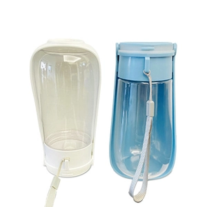 Detail showing white and blue portable pet water bottles with folding drinking troughs