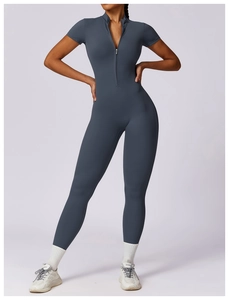 Close-up of short sleeve yoga jumpsuit with zipper collar and sleek athletic fit