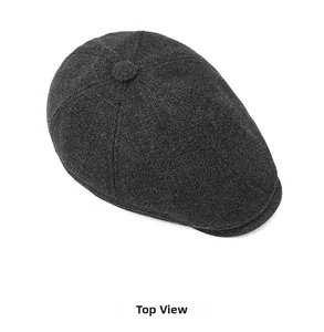 Top view of dark grey wool blend newsboy cap with classic paneled crown and brim