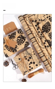 Detail showing vintage kraft paper with black botanical prints and natural twine accessories