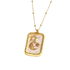 Gold star and crescent moon rectangular pendant necklace with sparkling pink details