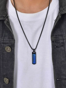 Detail of a men's rectangular blue lapis stone pendant necklace worn by a male model