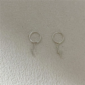 Macro shot of silver lightning hoop earrings with sparkling pavé micro-inlaid rhinestones