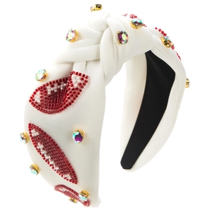 White knotted headband with beaded lips and multicolored rhinestones for a sporty look