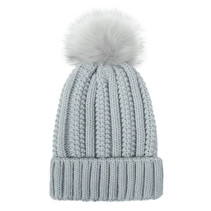 Detailed knit texture and soft faux fur pom-pom on light grey winter beanie cap