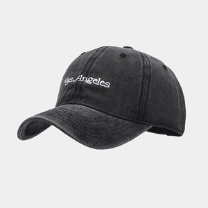 Detail of Los Angeles embroidery on vintage washed cotton baseball cap with curved brim