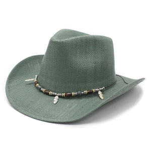 Wide brim woven straw cowboy hat in sage green with ethnic feather and bead details