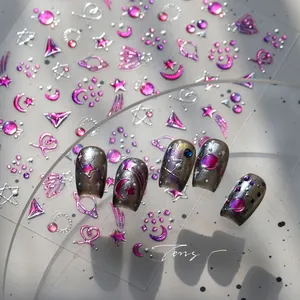 Macro detail of M-856 celestial nail art stickers with metallic pink moon and star patterns