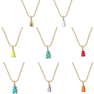 Golden tennis chain necklaces with colorful gummy bear pendants in eight vibrant colors