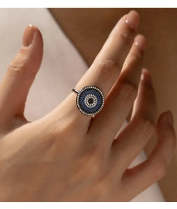 Detailed close-up of a S925 silver Evil Eye ring with multi-color zircon pavé setting