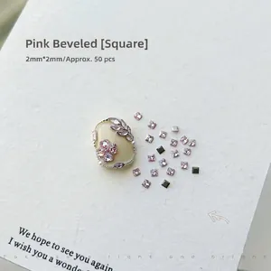 Close-up of pink 2mm square flatback rhinestones for nail art decoration on display