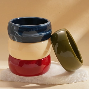 Retro acrylic resin bangles in deep blue marble, cream, red, and olive green colors