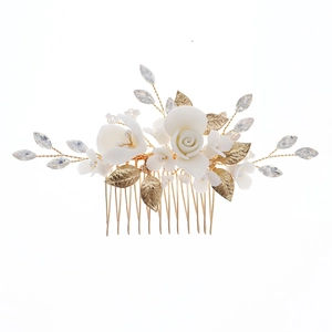 Handmade bridal hair comb with white ceramic flowers and golden metallic leaf accents