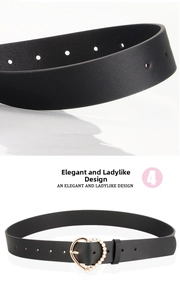 Close-up of black leather belt with golden heart buckle and elegant pearl inlay detailing