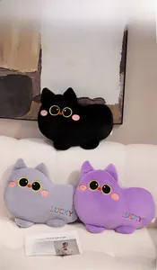Detailed view of plush cat pillows in black, grey, and purple on a cozy sofa