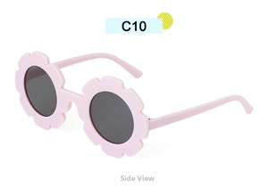 Side view of pink flower-shaped children's sunglasses with round dark grey lenses
