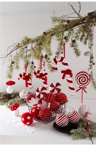 Detailed view of red and white striped candy canes and glittery Christmas tree ornaments