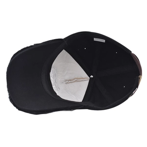 Detail of 100% cotton baseball cap interior with reinforced lining and metal buckle strap