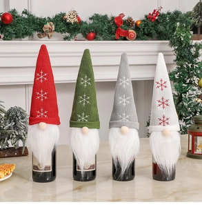 Close-up of Christmas gnome wine bottle covers with snowflake embroidery and plush beards