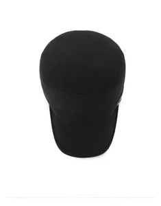 Top view of a black flat top military cap showing the structured crown and stitched brim