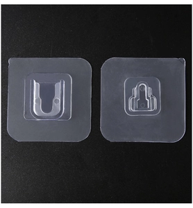 Macro view of clear self-adhesive wall mount hooks with strong adhesive backing stickers