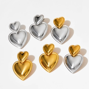 Polished double heart stud earrings in gold, silver, and two-tone stainless steel finishes