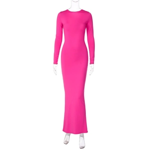 Detail of rose red long sleeve bodycon dress showing textured stretch fabric and slim fit