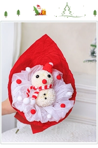 Detail of Christmas snowman pom-pom mum bouquet with red hat and knitted scarf decor