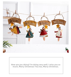 Detail of four Nordic style wooden Christmas angel pendants hanging on a jute rope decoration