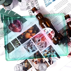 Rectangular green translucent resin mold tray with embedded lifestyle scene patterns