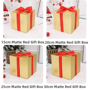 Detail of matte gold Christmas gift boxes with red ribbons in 15cm to 30cm sizes