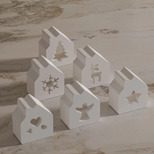 Détails de six moules en silicone en forme de maison avec flocons et motifs rennes