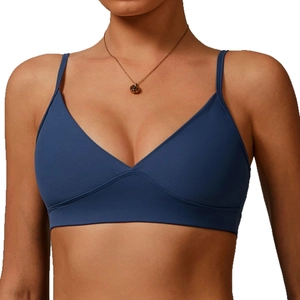 Navy blue V-neck sports bra with thin straps and wide elastic band for yoga running