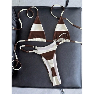 Two-piece bikini set with brown and white stripes, halter neck top and side-buckle bottoms