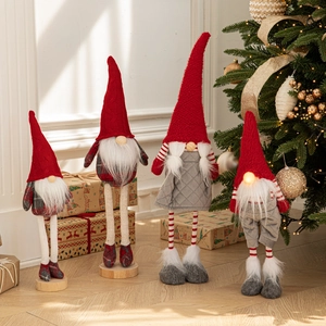 Set of four Christmas gnomes in red and grey with plush beards and glowing noses