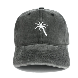 Washed dark grey baseball cap with white palm tree embroidery in retro style