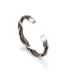 Detail of Thai silver style hammered wire braided bracelet with vintage texture and open design