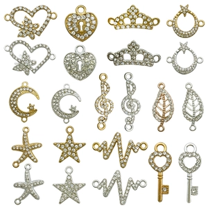 DIY rhinestone jewelry charms including heart, crown, and star in gold and silver finishes