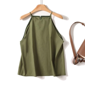 Detail of army green halter neck top hanging with a stylish brown leather bag