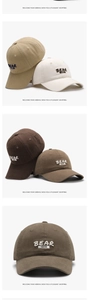 Detail of 3D embroidered Bear Discover letters on a washed cotton baseball cap