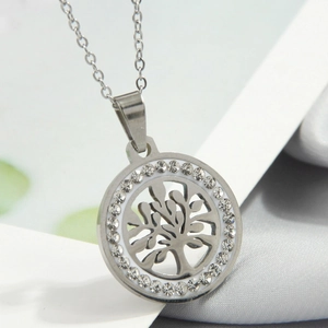 Detail view of silver tree of life pendant with sparkling crystal halo on fine chain