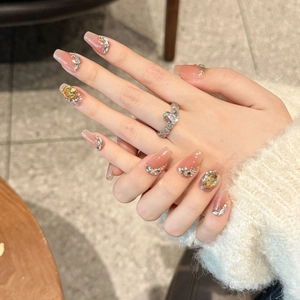 French style long trapezoid press-on nails with nude pink base and yellow rhinestones