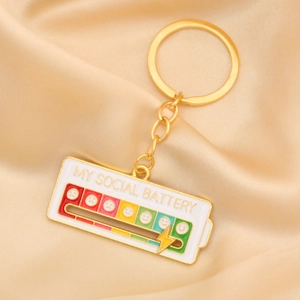 Macro view of my social battery pin on silk background showing green slider detail