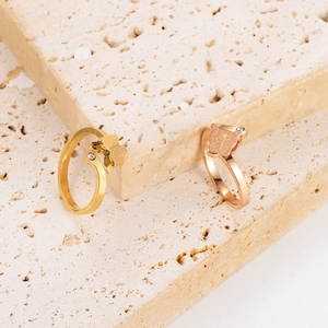 Frosted butterfly open rings in gold and rose gold with zircon accents on stone base