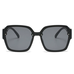 Classic square black sunglasses with silver rivet accents and gradient grey lenses